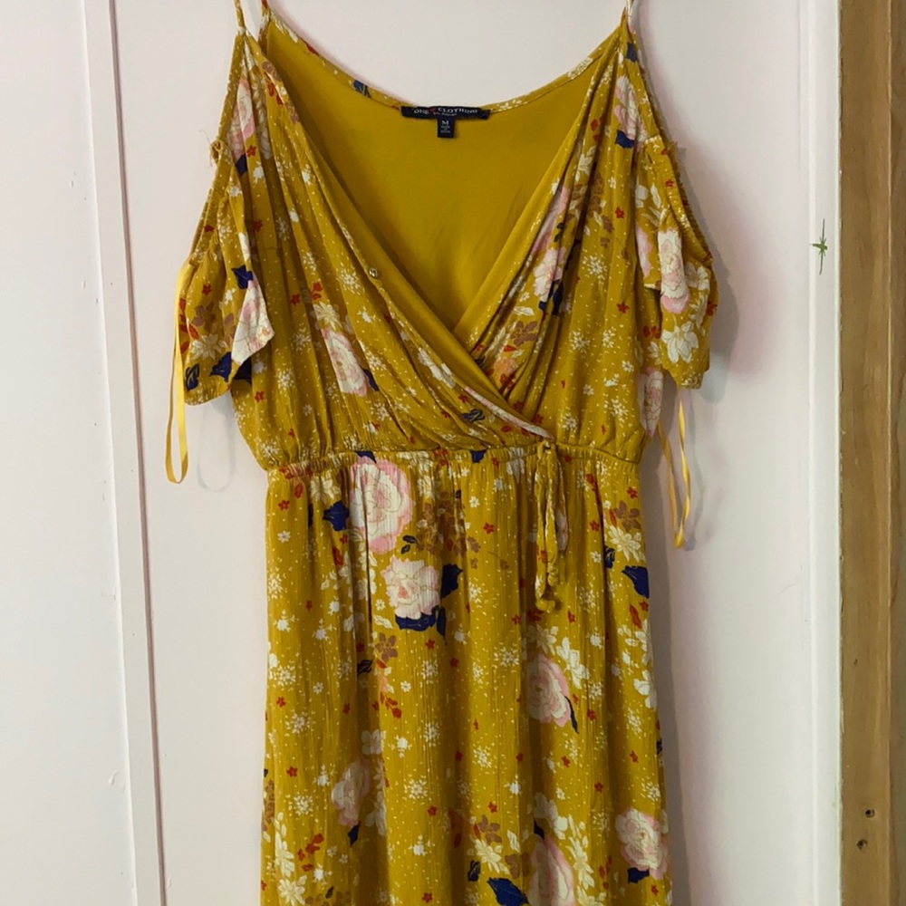 Yellow colored dress with flower designs